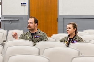 Aaron Wenner, Test and Evaluation University department chair and Maj. Courtnie Baxley, Test and Evaluation University department chair, evaluate students as they present their final projects in the Test Foundations Short Course at the U.S. Air Force Test Pilot School. (U.S. Air Force photo by Lindsey Iniguez)