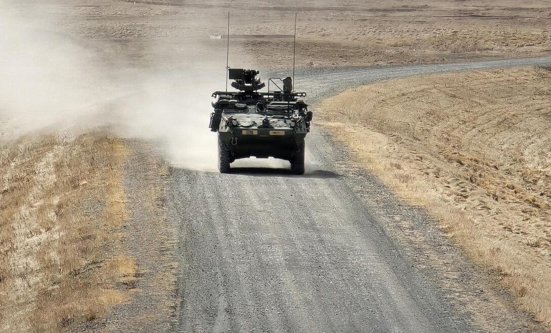 A 95th Chemical Company Stryker Nuclear, Biological, Chemical Reconnaissance Vehicle drives down a range road during gunnery qualification at Richardson Training Area, Alaska, May 2, 2026.