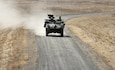 A 95th Chemical Company Stryker Nuclear, Biological, Chemical Reconnaissance Vehicle drives down a range road during gunnery qualification at Richardson Training Area, Alaska, May 2, 2026.