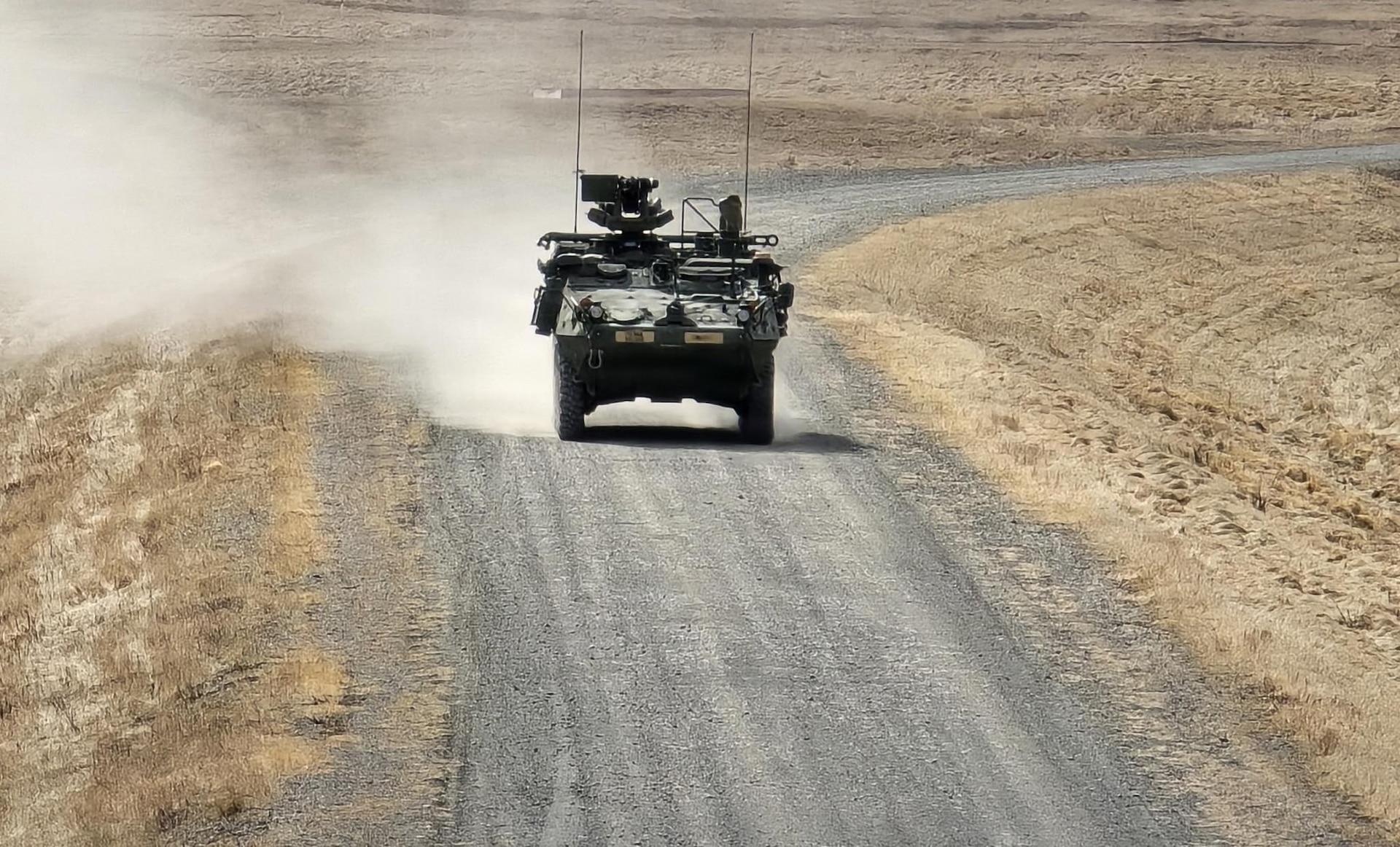 A 95th Chemical Company Stryker Nuclear, Biological, Chemical Reconnaissance Vehicle drives down a range road during gunnery qualification at Richardson Training Area, Alaska, May 2, 2026.