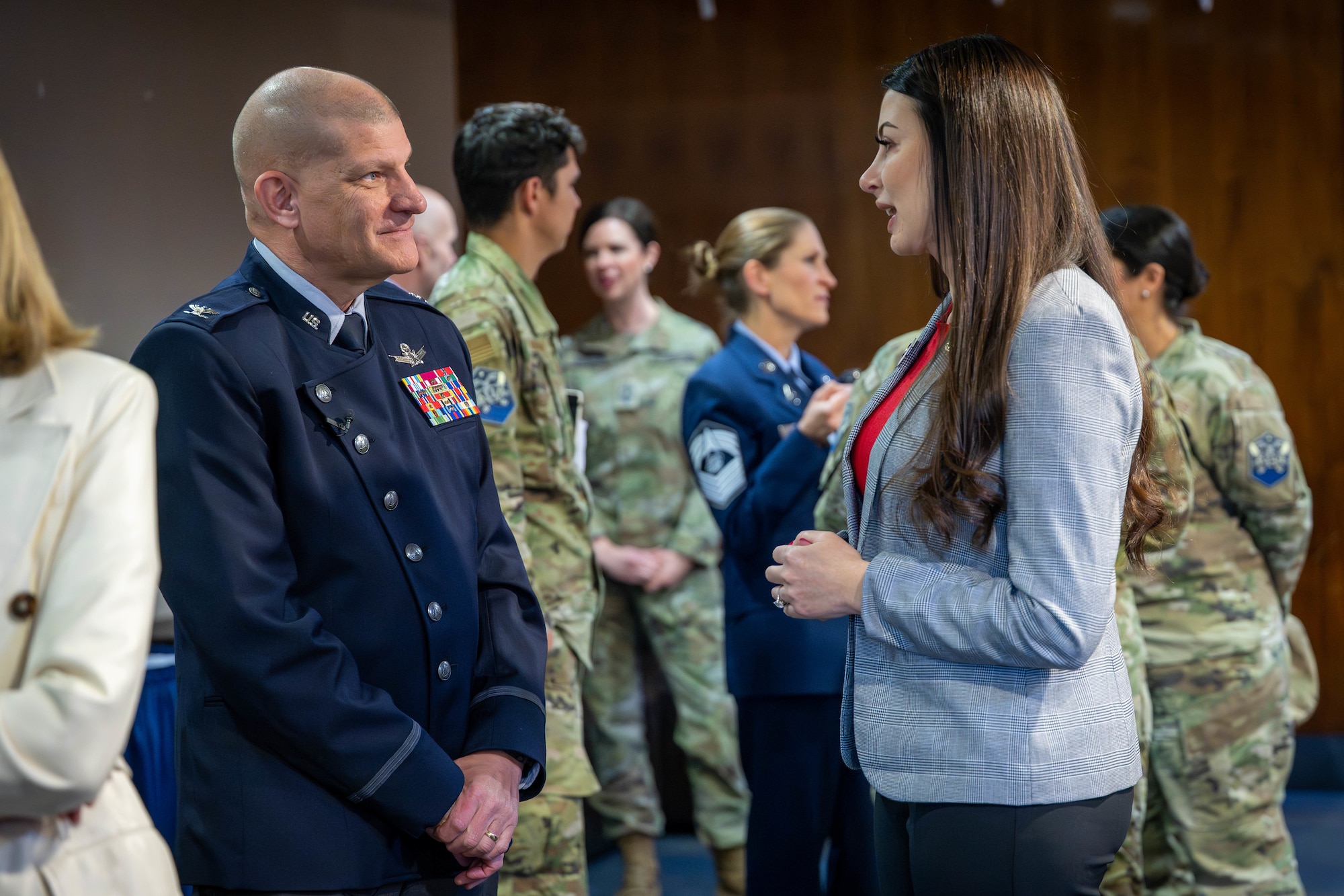 Col. Klock speaks with Rep. Flanell during the event.