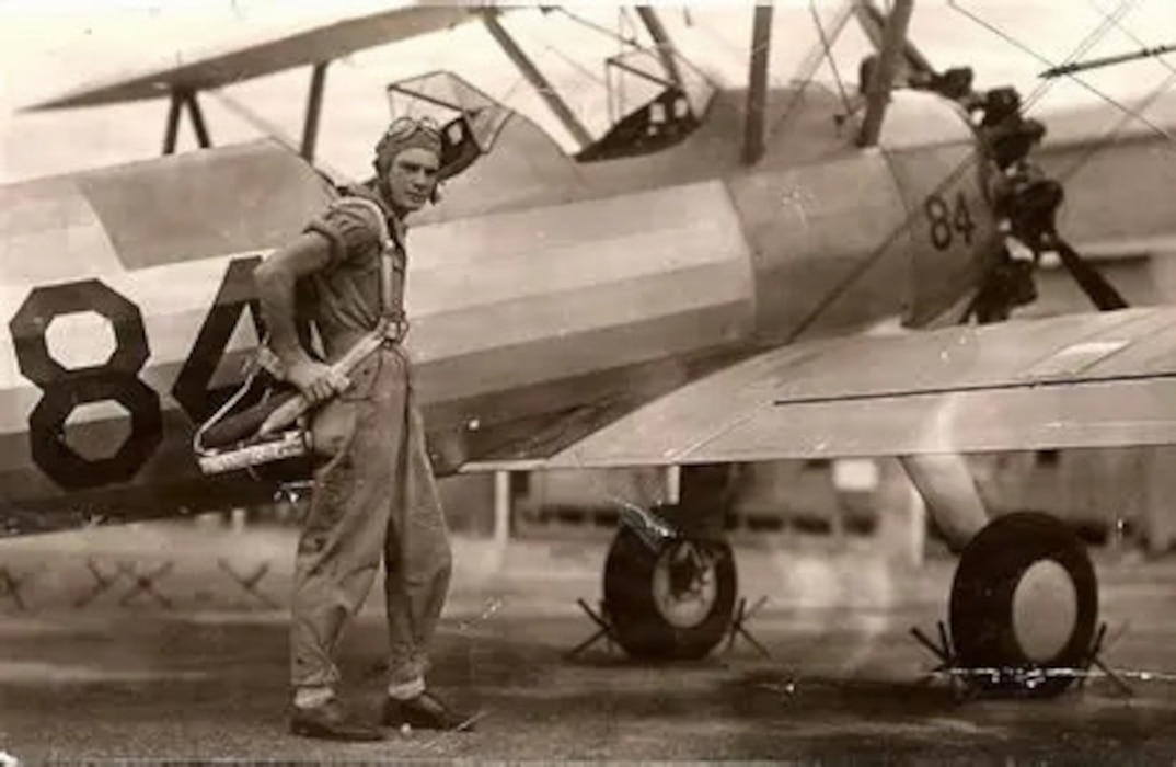 Person standing outside of an airplane.