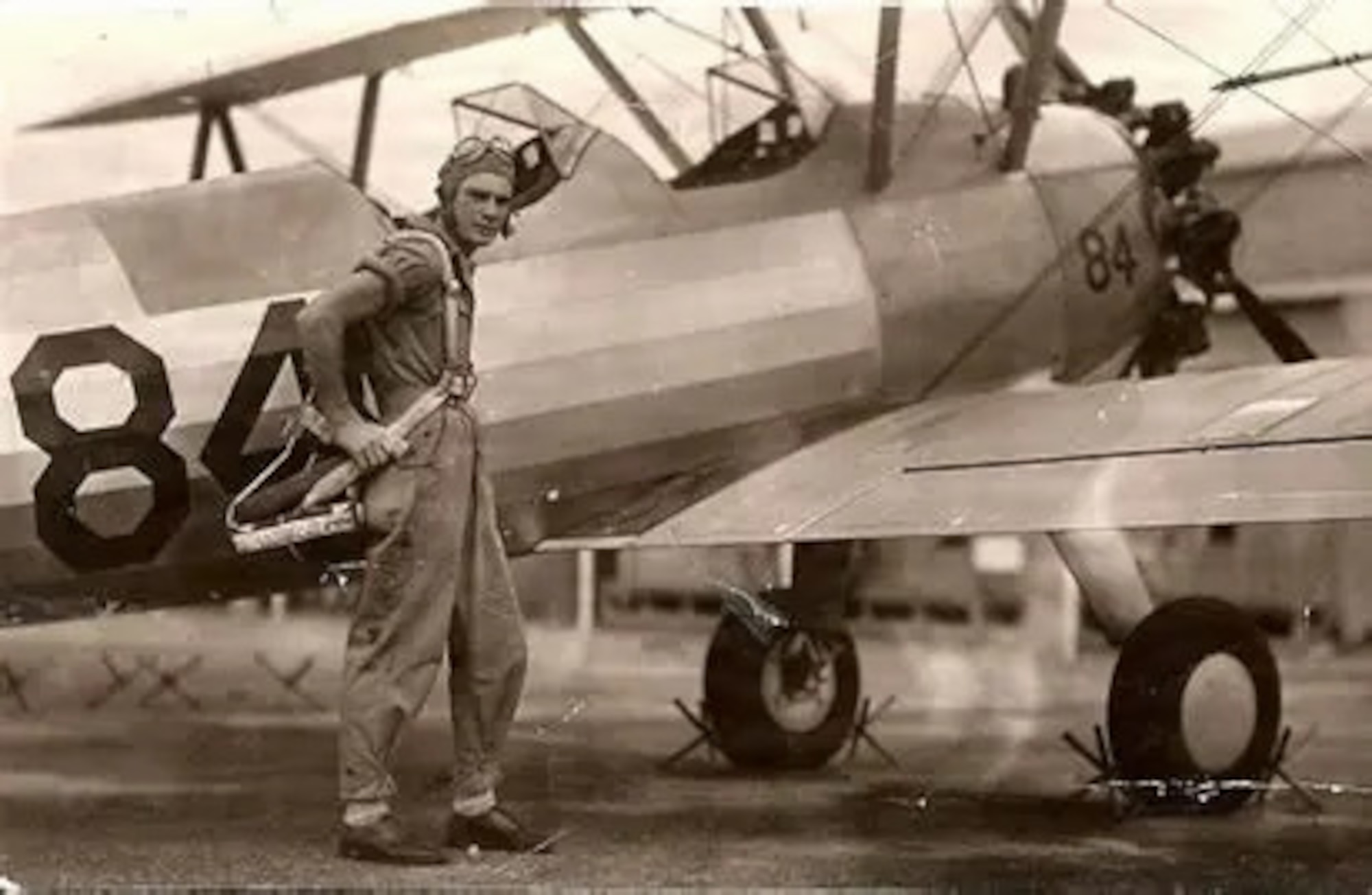 Person standing outside of an airplane.