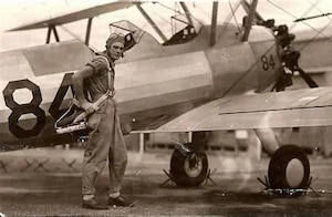 Person standing outside of an airplane.