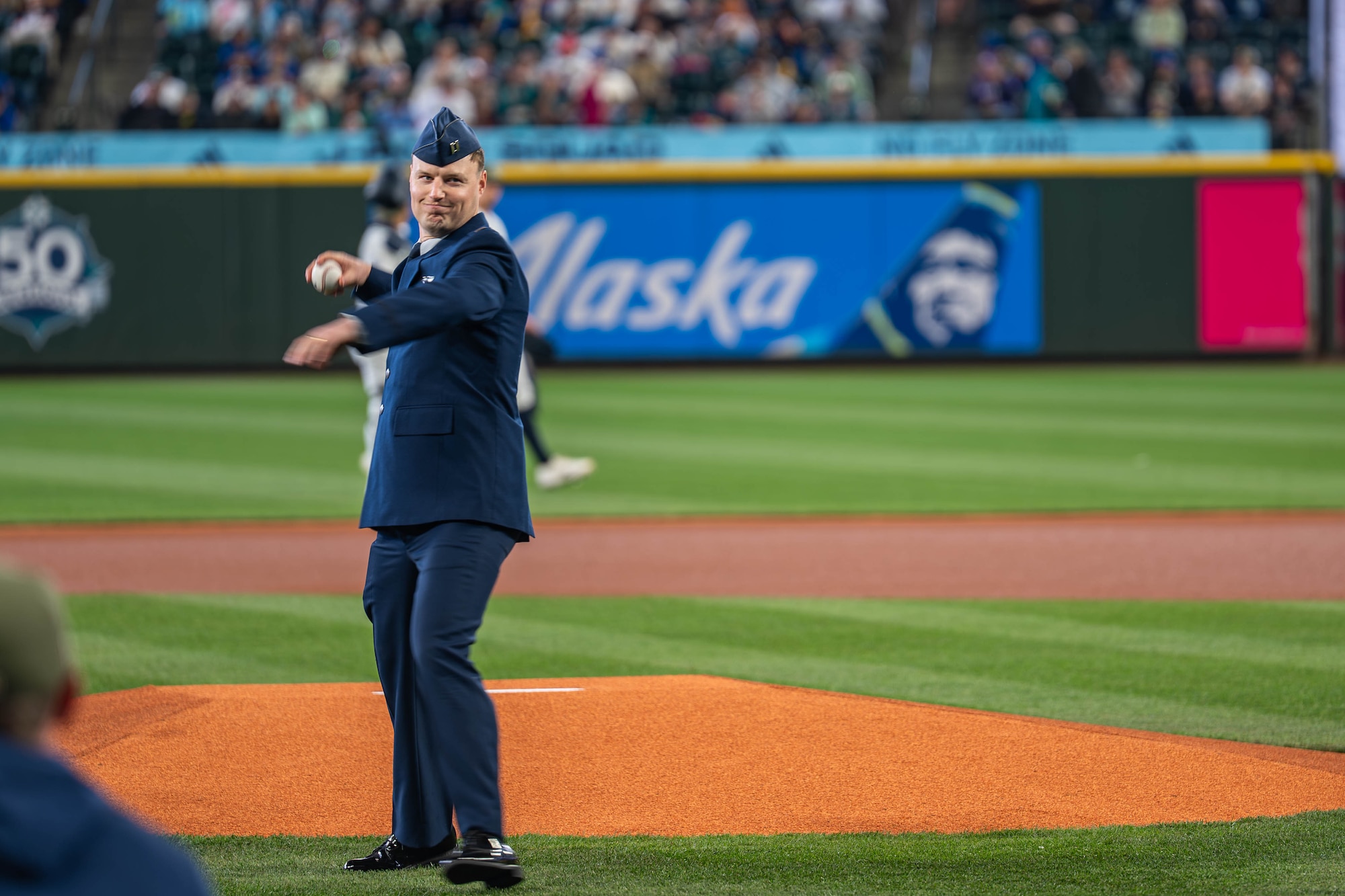 A man throws a baseball