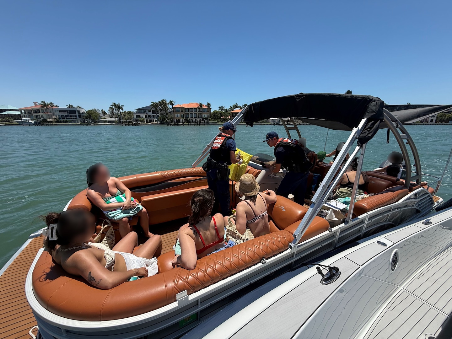 A Coast Guard Station Cortez law enforcement crew, with assistance from Sarasota Police Department, terminated an illegal charter vessel, Friday, near Big Sarasota Pass, Florida. Coast Guard officers deemed the vessel acted as a small passenger vessel without certificate of inspection, terminated the charter’s voyage, and escorted the boat and passengers back to Nora Patterson park, Siesta Key. (U.S. Coast Guard courtesy photo)
