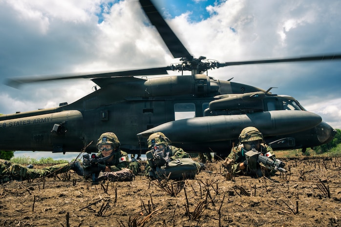Japan Ground Self-Defense Force soldiers assigned to 2nd Infantry Regiment, 12th Brigade, pull security after being transported from a UH-60 Blackhawk assigned to Task Force Saber, 25th Combat Aviation Brigade, 25th Infantry Division, during a multinational air assault mission part of the Joint Pacific Readiness Center Exportable Exercise at Fort Magsaysay, Nueva Ecija, Philippines, May 17, 2026.