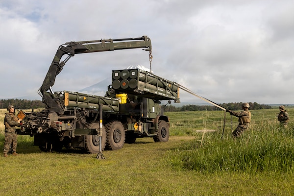 U.S. Marines with 3rd Battalion, 12th Marine Regiment, load a rocket pod onto a High Mobility Artillery Rocket System to conduct live fire missions during a live fire training event at the Combined Arms Training Center, Camp Fuji, Japan, May 20, 2026.