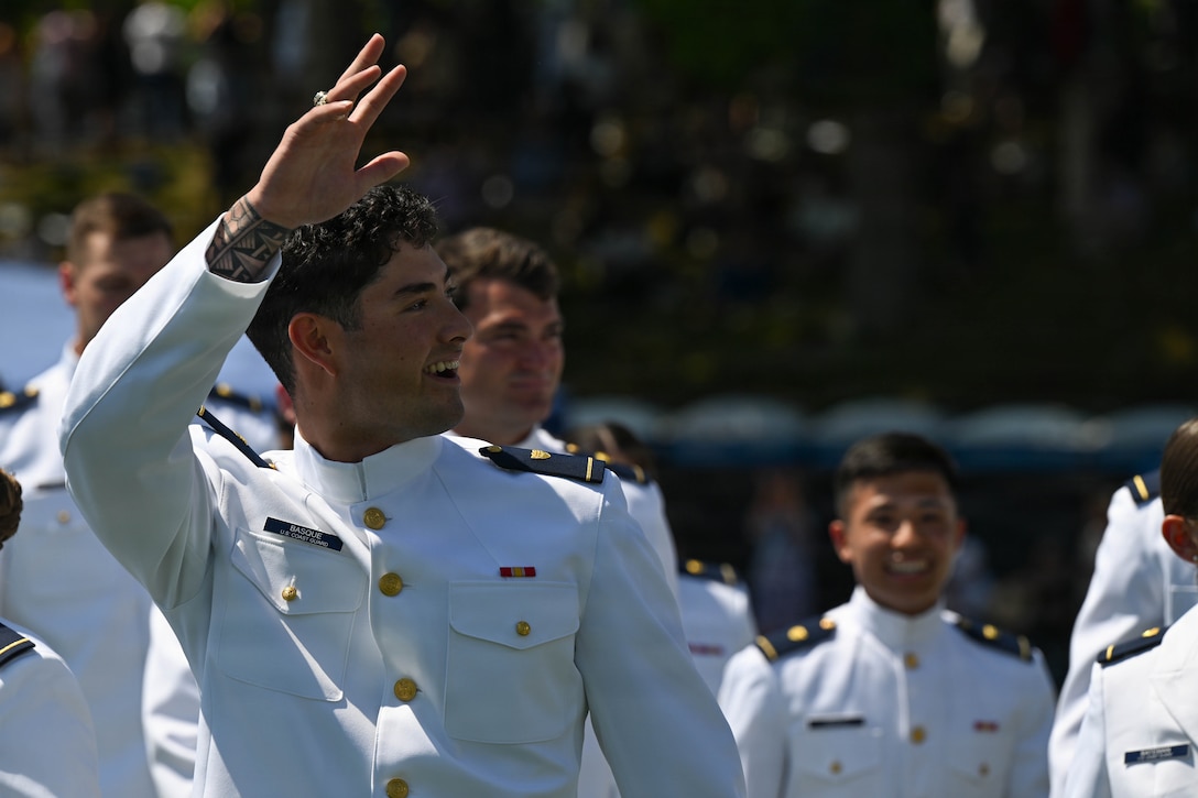 U.S. Coast Guard Academy Cadet 1st Class Drew Kamakanikipu‘upu‘u Basque waves to the audience during the U.S. Coast Guard Academy graduation ceremony in New London, Connecticut, May 20, 2026. Approximately 260 U.S. graduates from the Class of 2026 received commissions and earned Bachelor of Science degrees. (U.S. Coast Guard photo by Petty Officer 3rd Class Lyric Jackson)