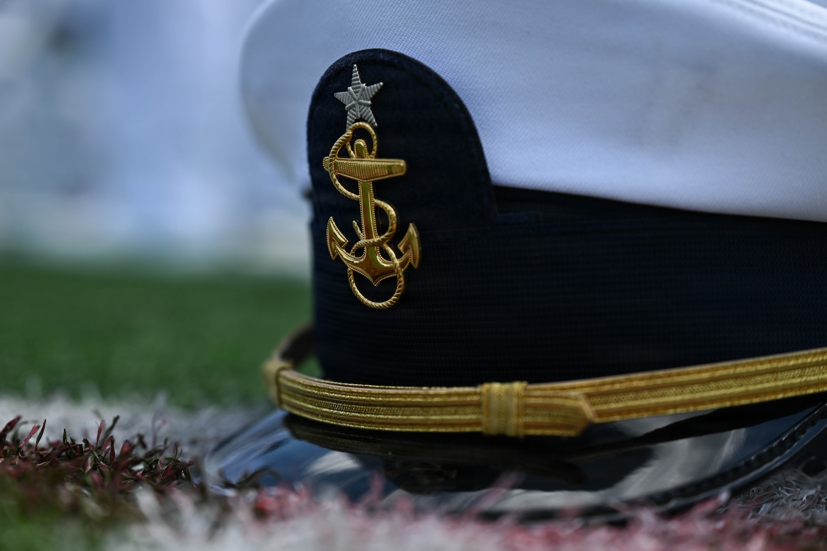 A cadet cover rests on the ground after the U.S. Coast Guard Academy graduation ceremony in New London, Connecticut, May 20, 2026. The tradition of throwing cadet covers signifies graduates’ transition from cadets to commissioned officers in the U.S. Coast Guard.