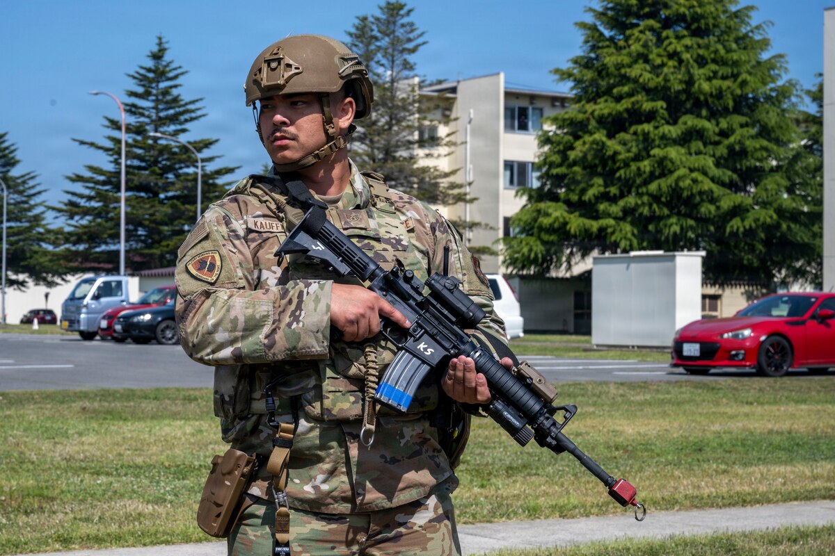 U.S. Air Force Staff Sgt. Conrad Kauffman, 35th Security Forces Squadron military working dog handler, stands watch during an active shooter exercise at Misawa Air Base, Japan, May 18, 2026.