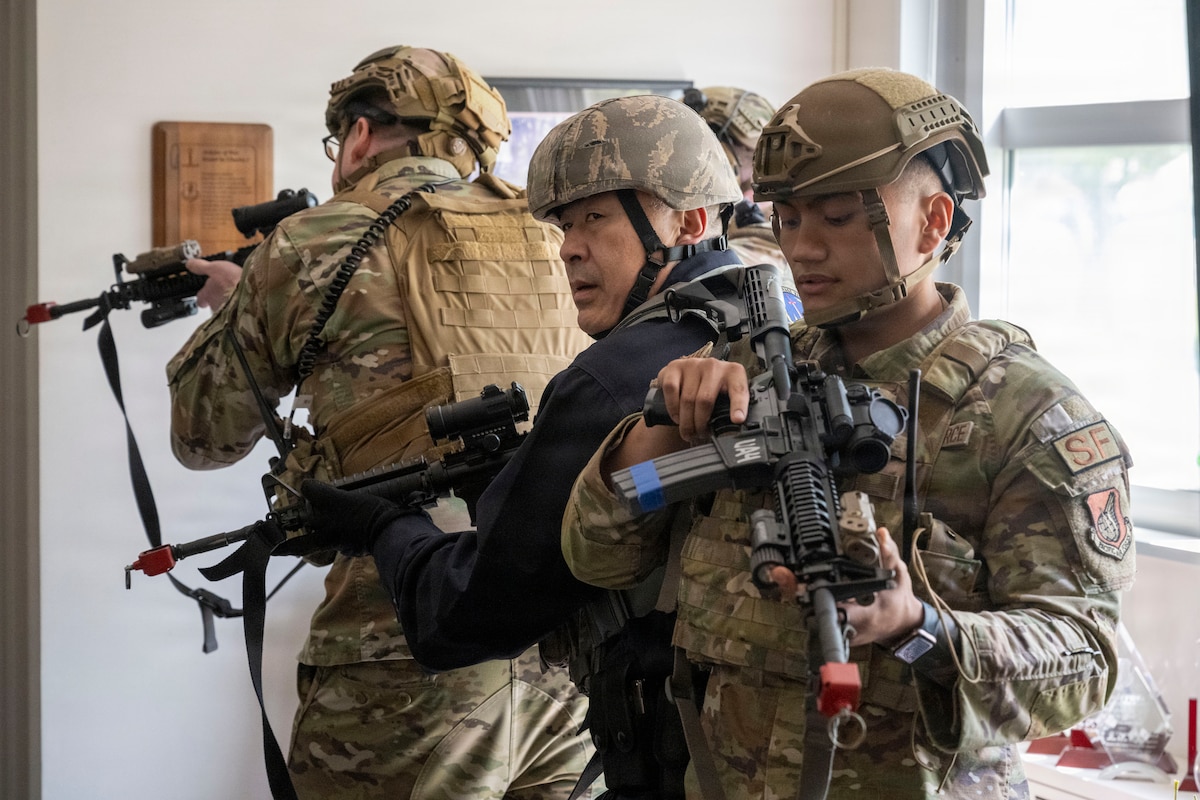 U.S. Airmen and a Japanese master labor contract employee assigned to the 35th Security Forces Squadron conduct a building sweep during an active shooter exercise at Misawa Air Base, Japan, May 18, 2026.