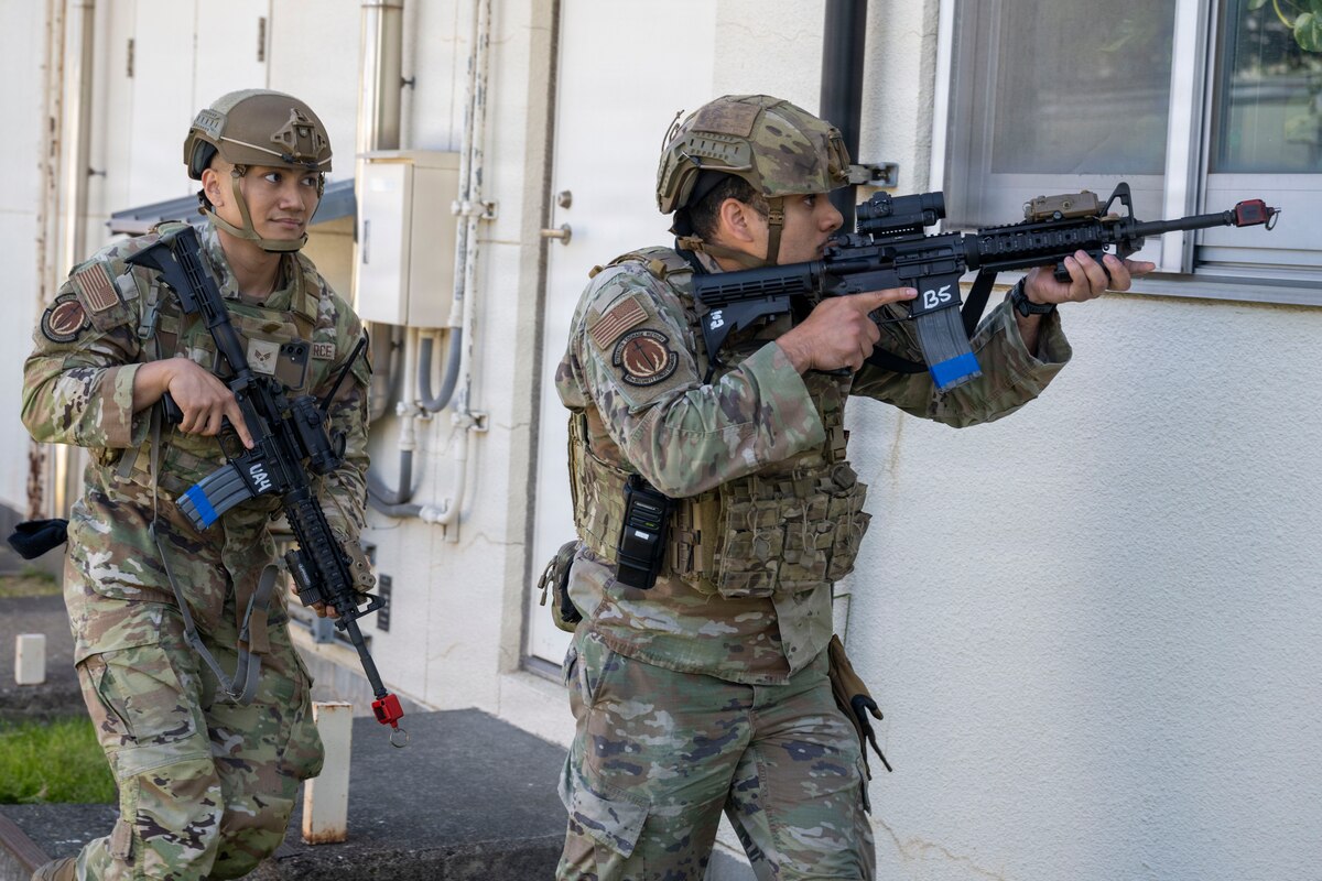 U.S. Air Force Senior Airman Jericho Briones, and Staff Sgt. Luyando Delgado, 35th Security Forces Squadron defenders, approach a building entrance during an active shooter exercise at Misawa Air Base, Japan, May 18, 2026.