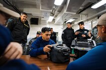 U.S. Navy Diver 1st Class Benji Guerra assigned to Mobile Diving and Salvage Unit 1 tests a handheld sonar-based diver navigation and tracking system before participating in an integrated multinational dive to locate a simulated sunken vessel during Salvage Exercise Korea 2026 at Jinhae Naval Base, Republic of Korea, April 7, 2026. Commander, Logistics Group Western Pacific/Task Force 73 sustains the U.S. Navy’s maritime forces and is responsible for all diving and salvage operations in the Western Pacific in support of a free and open Indo-Pacific. (U.S. Navy photo by Mass Communication Specialist 2nd Class Jordan Jennings)