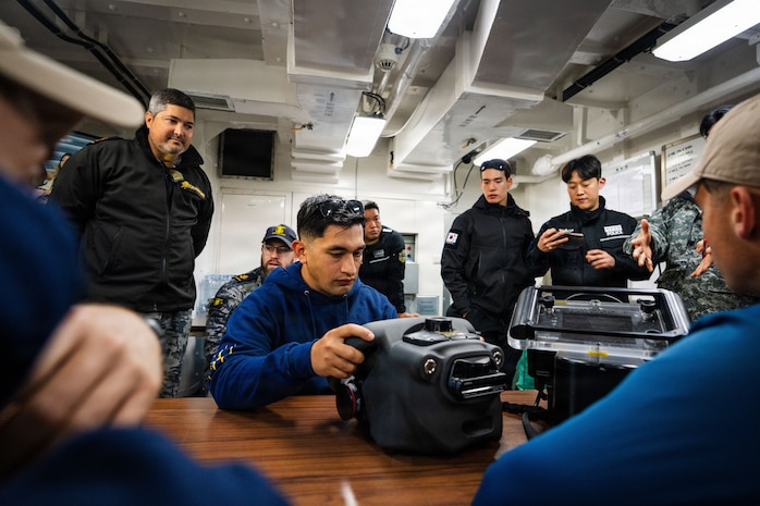 U.S. Navy Diver 1st Class Benji Guerra assigned to Mobile Diving and Salvage Unit 1 tests a handheld sonar-based diver navigation and tracking system before participating in an integrated multinational dive to locate a simulated sunken vessel during Salvage Exercise Korea 2026 at Jinhae Naval Base, Republic of Korea, April 7, 2026. Commander, Logistics Group Western Pacific/Task Force 73 sustains the U.S. Navy’s maritime forces and is responsible for all diving and salvage operations in the Western Pacific in support of a free and open Indo-Pacific. (U.S. Navy photo by Mass Communication Specialist 2nd Class Jordan Jennings)