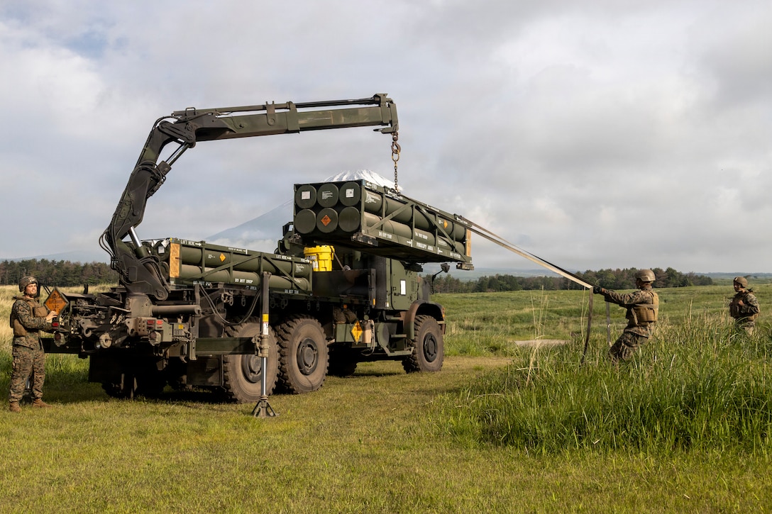 U.S. Marines with 3rd Battalion, 12th Marine Regiment, load a rocket pod onto a High Mobility Artillery Rocket System to conduct live fire missions during a live fire training event at the Combined Arms Training Center, Camp Fuji, Japan, May 20, 2026. HIMARS training at Camp Fuji offers unique advantages, including realistic training terrain, adequate range capacity, and specialized infrastructure necessary to safely and effectively support HIMARS operations. This training validates Camp Fuji’s capability to support long-range fires and reflects our commitment to maintaining readiness and maximizing deterrence in the Indo-Pacific. (U.S. Marine Corps photo by Lance Cpl. Skilah Sanchez)