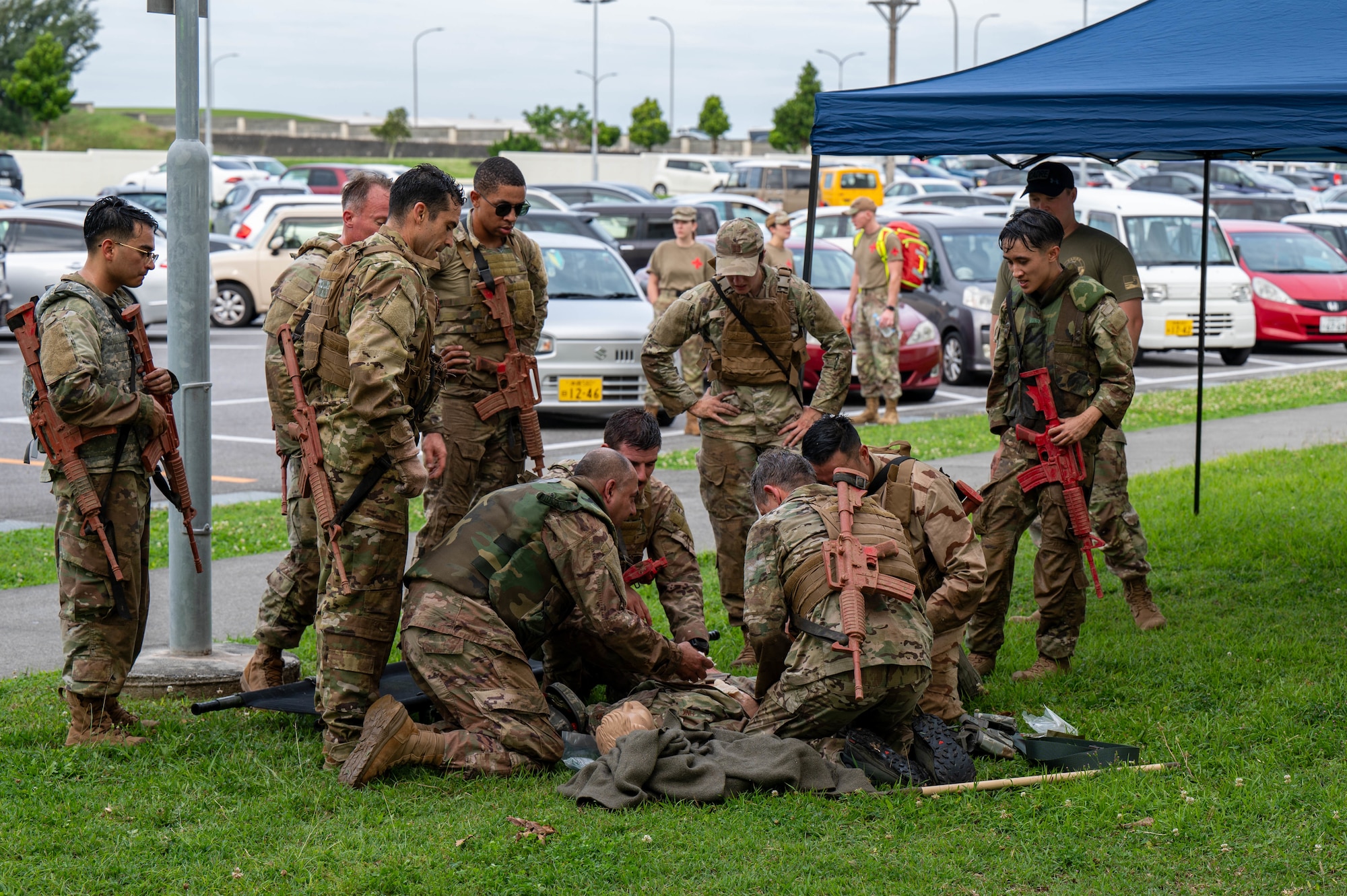 The U.S. Air Force 18th Wing command team performs Combat Casualty Care while participating in the Combat Readiness Challenge at Kadena Air Base, Japan, May 15, 2026. The event served as an opportunity for leadership to engage directly with Airmen while promoting a culture centered on resilience and warrior ethos. (U.S. Air Force photo by Airman 1st Class Nathaniel Jackson)