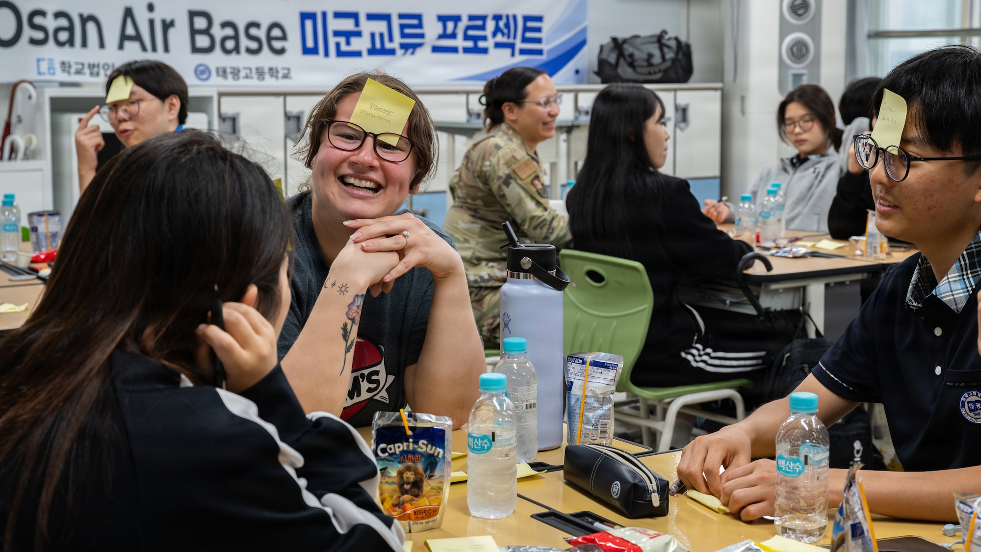 U.S. Airmen and Taegwang High School students plays a game.