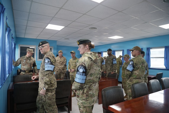 The Chiefs of Army and their senior enlisted leaders tour one of the blue “Conference Row” buildings inside the Joint Security Area during their visit. The tour is part of a strategic engagement hosted by LTGEN Winter for Chiefs of Army and Sergeants Major from Australia, Canada, New Zealand, and the United Kingdom on April 22, 2026.