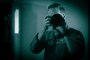 U.S. Air Force Col. Paul Davidson, 35th Fighter Wing (FW) commander, looks through the viewfinder of a camera equipped with a night vision adapter during a Wild Weasel Walk-through of the 35th FW Public Affairs unit at Misawa Air Base, Japan, May 18, 2026. (U.S. Air Force photo illustration by Senior Airman Gavin Hameed) (This image was altered to simulate white phosphorus night vision)