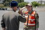 U.S. Air Force Airman 1st Class Jessel Fabara, right, 35th Fighter Wing (FW) Public Affairs specialist, salutes Col. Paul Davidson, 35th FW commander, during a Wild Weasel Walk-through at Misawa Air Base, Japan, May 18, 2026. (U.S. Air Force photo by Senior Airman Gavin Hameed)