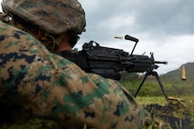 U.S. Marine Corps Lance Cpl. Christian Zuniga, an inventory management specialist with Combat Logistics Regiment 35, 3rd Marine Logistics Group, fires an M240B machine gun on Camp Hansen, Okinawa, Japan, April 21, 2026. CLR-35 conducted live-fire training, improving their proficiency with crew-served weapon systems and enhanced force protection capabilities in an expeditionary advanced base operations environment. (U.S. Marine Corps photo by Cpl. Pedro Rojas)