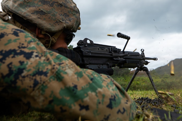 U.S. Marine Corps Lance Cpl. Christian Zuniga, an inventory management specialist with Combat Logistics Regiment 35, 3rd Marine Logistics Group, fires an M240B machine gun on Camp Hansen, Okinawa, Japan, April 21, 2026. CLR-35 conducted live-fire training, improving their proficiency with crew-served weapon systems and enhanced force protection capabilities in an expeditionary advanced base operations environment. (U.S. Marine Corps photo by Cpl. Pedro Rojas)