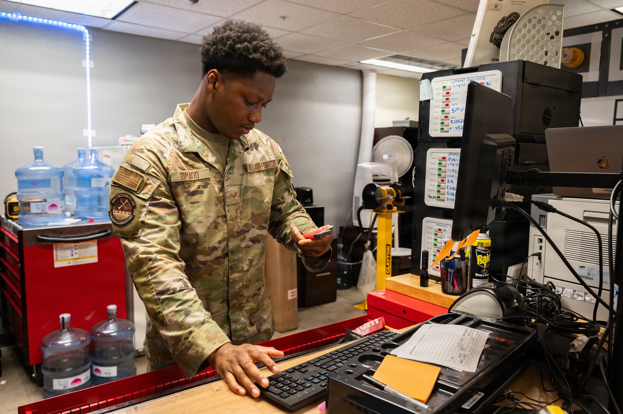An Airman looks at equipment.