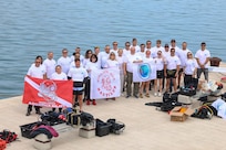 Sailors from Underwater Construction Team (UCT) 1, Construction Dive Detachment Charlie (CDD/C), pose with members from a Croatian dive team before they clean the ocean of trash in Pag, Croatia, May 8, 2026.