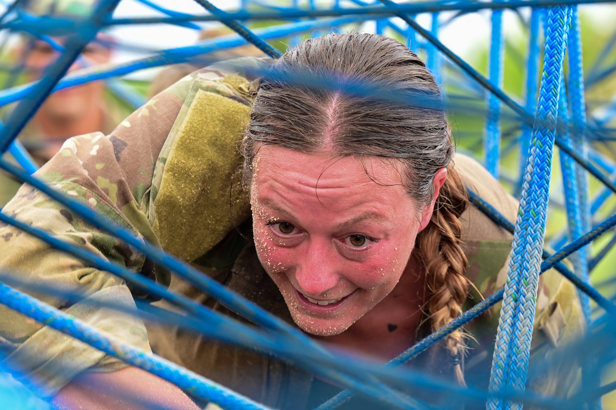 U.S. Air Force Staff Sgt. Cambrea Thompson, assigned to the 36th Security Forces Squadron, crawls through an obstacle during Pacific Air Force’s 9th Annual Advanced Combat Skills Assessment Competition at Northwest Field, Andersen Air Force Base Guam, May 21, 2026.