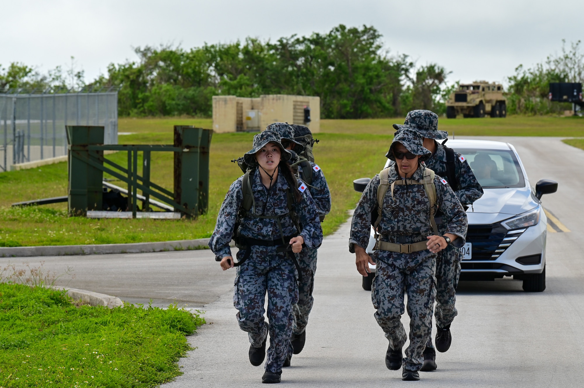 Japan Air Self-Defense Force airmen participate in a ruck during Pacific Air Force’s 9th Annual Advanced Combat Skills Assessment Competition at Northwest Field, Andersen Air Force Base Guam, May 21, 2026.