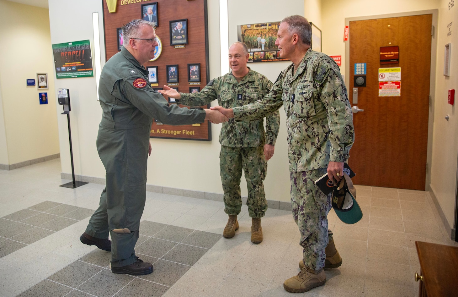 Vice Adm. Mike Vernazza, Commander, Naval Information Forces, was welcomed by Rear Adm. Kenneth Blackmon, Vice Commander, U.S. Fleet Forces Command, and Rear Adm. Jason Naidyhorski, Vice Commander, U.S. Sixth Fleet and Director, Maritime Partnership Program, U.S. Sixth Fleet at Navy Warfare Development Center (NWDC) during the 2026 MAKO Storm event in Norfolk, Virginia, on May 15, 2026.