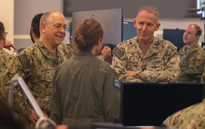 Vice Adm Michael Vernazza and Rear Adm. Kenneth Blackmon received feedback from participating Sailors on the effectiveness of MAKO Storm, an advanced Maritime Operations Center training event focused on strengthening operational integration, decision-making, and fleet readiness across the force, during the fifth annual MAKO Storm exercise hosted by the Navy Warfare Development Center in Norfolk, May 14–17, 2026.