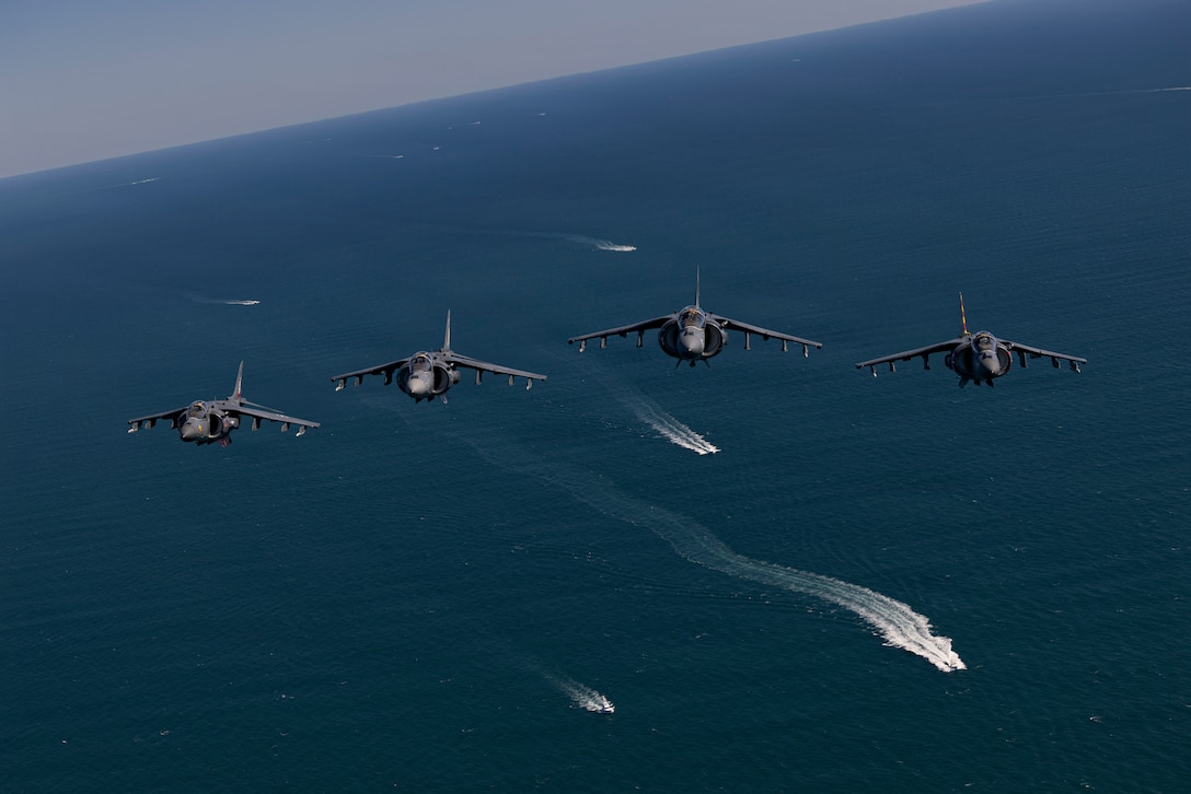 U.S. Marine Corps AV-8B Harrier II aircraft with Marine Attack Squadron (VMA) 223, Marine Aircraft Group 14, 2nd Marine Aircraft Wing, fly over the coast of North Carolina, May 15, 2026. The “sundown” of the AV-8B Harrier II, an iconic aircraft that has supported joint and Marine Corps operations for 40 years, also represents the dawn of a new era; it paves the way for 2nd MAW’s full transition to the F-35B and C Lightning II. (U.S. Marine Corps photo by Lance Cpl. Perri Wood)