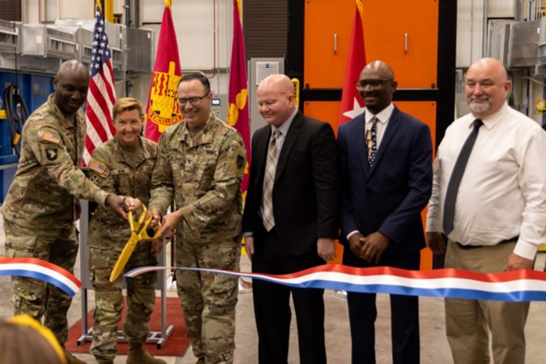 Picture of men cutting a ribbon.