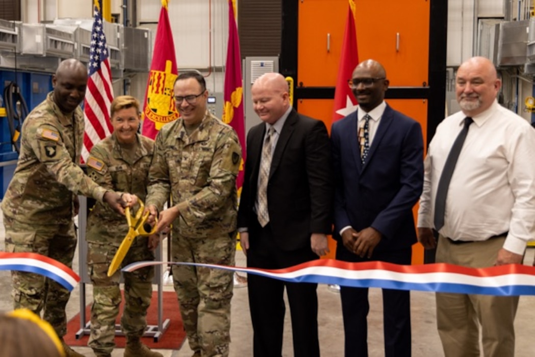 Picture of men cutting a ribbon.