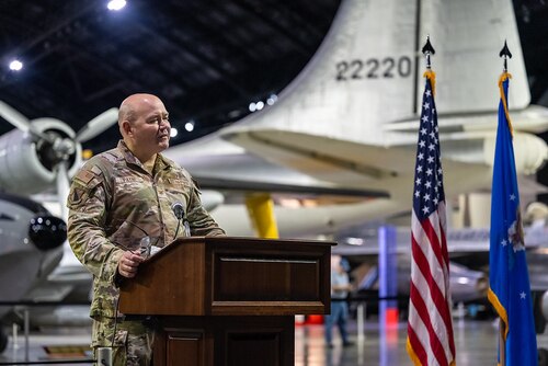 Members of the Wright-Patterson Air Force Base Chaplain Corps and local faith community attend the Legacy of Faith Luncheon at the National Museum of the U.S. Air Force while a senior Air Force chaplain delivers remarks.
