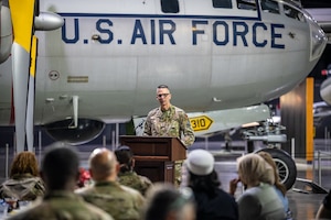 Members of the Wright-Patterson Air Force Base Chaplain Corps and local faith community attend the Legacy of Faith Luncheon at the National Museum of the U.S. Air Force while a senior Air Force chaplain delivers remarks.