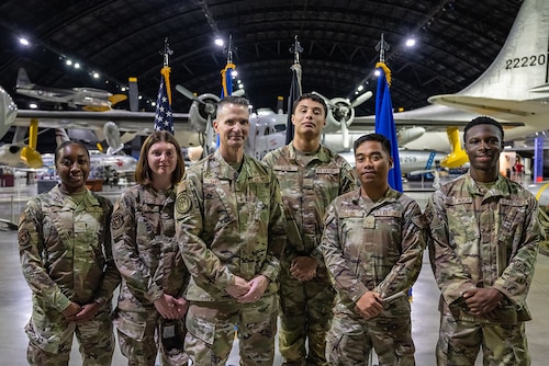Members of the Wright-Patterson Air Force Base Chaplain Corps and local faith community attend the Legacy of Faith Luncheon at the National Museum of the U.S. Air Force while a senior Air Force chaplain delivers remarks.