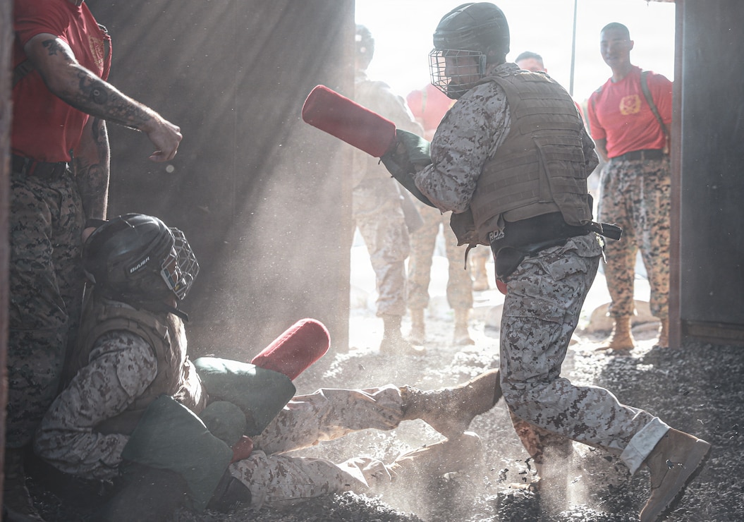 U.S. Marine Corps recruits with Charlie Company, 1st Recruit Training Battalion participate in a pugil sticks training event at Marine Corps Recruit Depot San Diego, California, April 21, 2026. Recruits are taught Marine Corps Martial Arts Program techniques that instill basic self-defense that they will execute throughout recruit training during events like body sparring and pugil sticks to help build a warrior ethos and Esprit de Corps. (U.S. Marine Corps photo by Cpl. Genaro I. Valdez-Sepulveda)