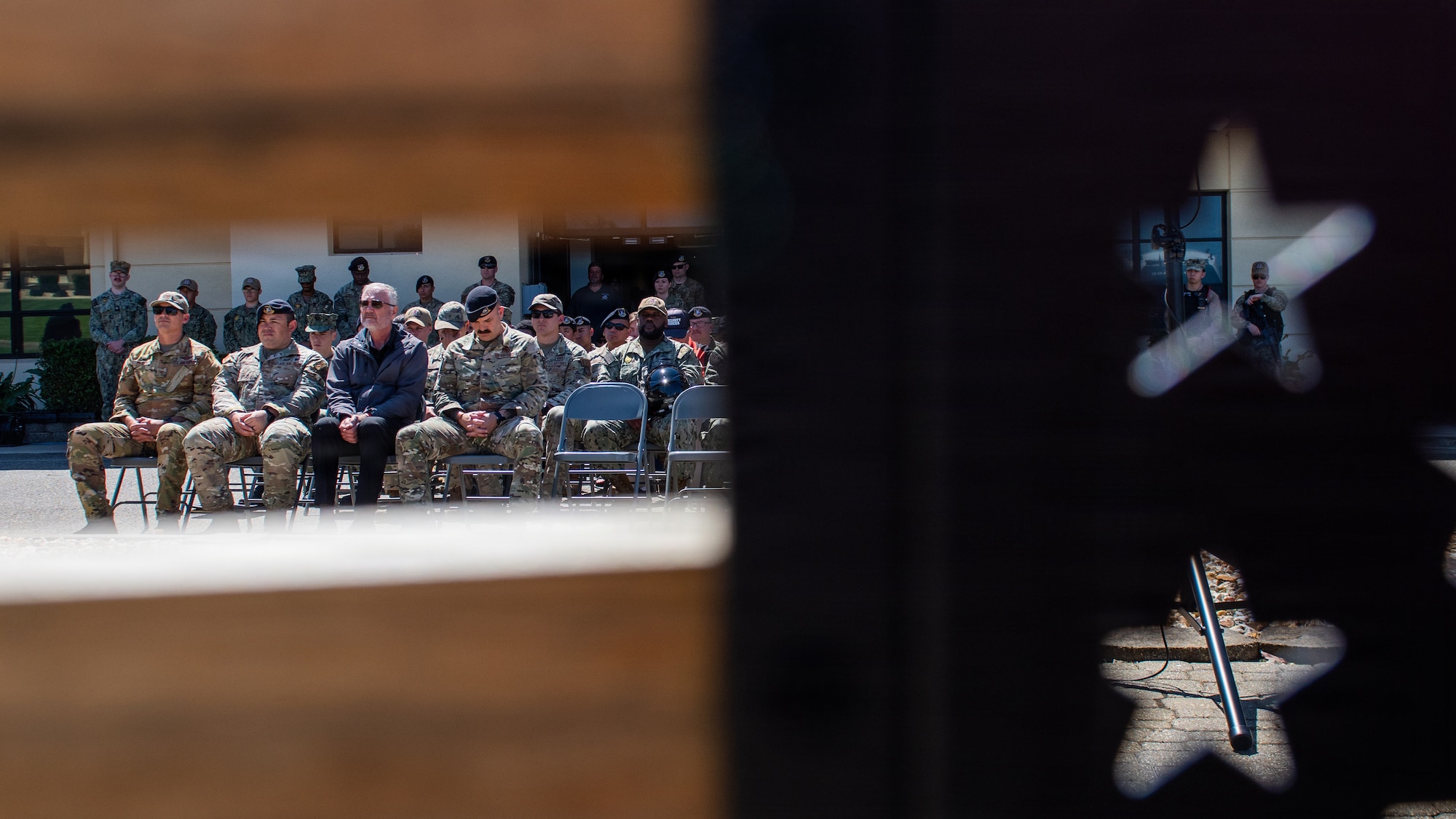 Attendees sit during a memorial ceremony