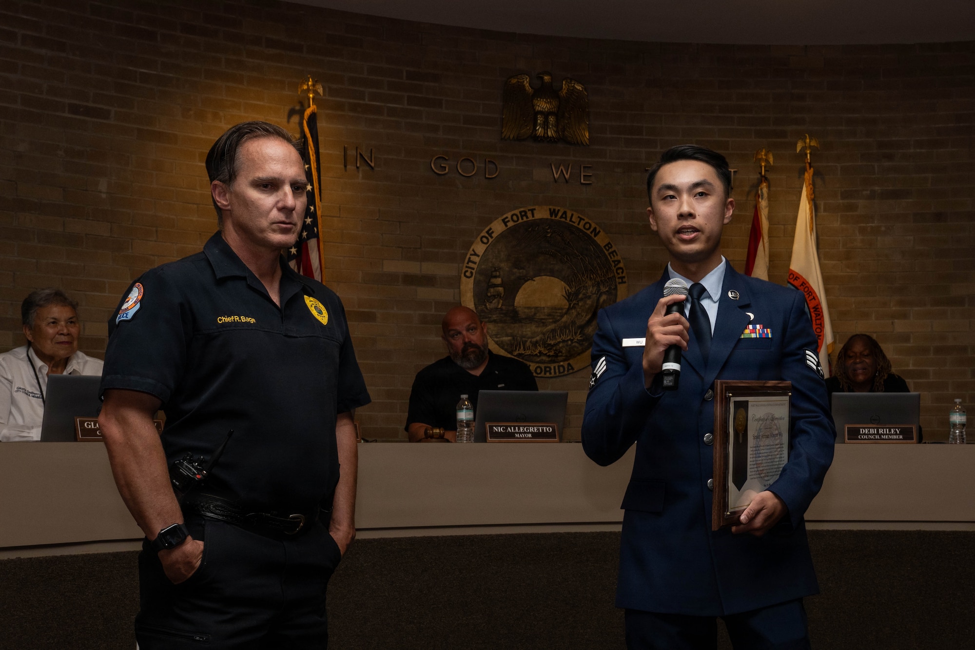 Airman speaks at city council meeting accompaniedby chief of police