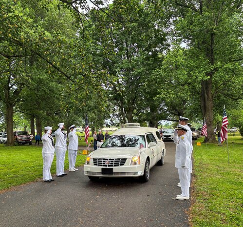 Sailors from the Navy Reserve Center Indianapolis and Naval Station Great Lakes, along with Rear Adm. Michael Richman, the deputy Portfolio Acquisition Executive (PAE) Strategic Systems Programs (SSP) for regional deterrence, salute the motorcade carrying Seaman 1st Class Wayne Edward Newton at Grandview Cemetery in Terre Haute, Ind., on May 16, 2026. 

Newton was killed in action on Dec. 7, 1941, during the attack on Pearl Harbor, while serving on USS California (BB-44), a Tennessee-class battleship. Newton’s remains were recently identified by the Defense POW/MIA Accounting Agency as part of the USS California Project, a forensic research and recovery initiative aiming to identify 25 previously unidentified Sailors and Marines killed in the attack. In the time-honored tradition of military funerals, Richman presented the folded American flag to Newton’s next of kin, his nephew Mr. Stephen Newton.