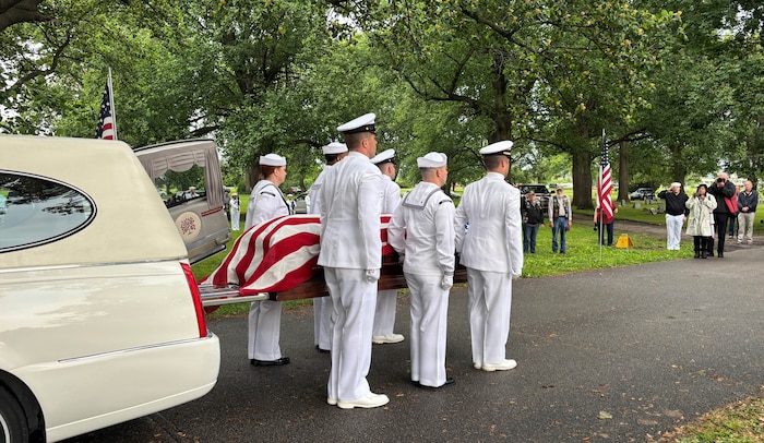 Sailors from the Navy Reserve Center Indianapolis and Naval Station Great Lakes carry the casket of Seaman 1st Class Wayne Edward Newton at Grandview Cemetery in Terre Haute, Ind., on May 16, 2026. 

Newton was killed in action on Dec. 7, 1941, during the attack on Pearl Harbor, while serving on USS California (BB-44), a Tennessee-class battleship. Newton’s remains were recently identified by the Defense POW/MIA Accounting Agency as part of the USS California Project, a forensic research and recovery initiative aiming to identify 25 previously unidentified Sailors and Marines killed in the attack. In the time-honored tradition of military funerals, Rear Adm. Michael Richman, the deputy Portfolio Acquisition Executive Strategic Systems Programs for regional deterrence, presented the folded American flag to Newton’s next of kin, his nephew Mr. Stephen Newton.