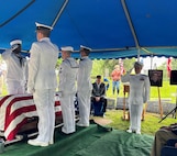 Sailors from the Navy Reserve Center Indianapolis and Naval Station Great Lakes, along with Rear Adm. Michael Richman, the deputy Portfolio Acquisition Executive (PAE) Strategic Systems Programs (SSP) for regional deterrence, salute the casket of Seaman 1st Class Wayne Edward Newton before burial at Grandview Cemetery in Terre Haute, Ind., on May 16, 2026. 

Newton was killed in action on Dec. 7, 1941, during the attack on Pearl Harbor, while serving on USS California (BB-44), a Tennessee-class battleship. Newton’s remains were recently identified by the Defense POW/MIA Accounting Agency as part of the USS California Project, a forensic research and recovery initiative aiming to identify 25 previously unidentified Sailors and Marines killed in the attack. In the time-honored tradition of military funerals, Richman presented the folded American flag to Newton’s next of kin, his nephew Mr. Stephen Newton.