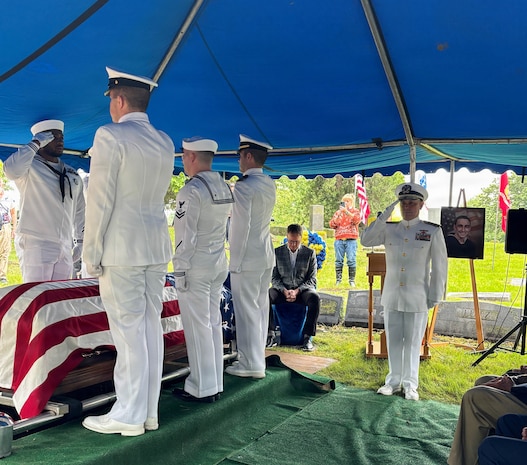 Sailors from the Navy Reserve Center Indianapolis and Naval Station Great Lakes, along with Rear Adm. Michael Richman, the deputy Portfolio Acquisition Executive (PAE) Strategic Systems Programs (SSP) for regional deterrence, salute the casket of Seaman 1st Class Wayne Edward Newton before burial at Grandview Cemetery in Terre Haute, Ind., on May 16, 2026. 

Newton was killed in action on Dec. 7, 1941, during the attack on Pearl Harbor, while serving on USS California (BB-44), a Tennessee-class battleship. Newton’s remains were recently identified by the Defense POW/MIA Accounting Agency as part of the USS California Project, a forensic research and recovery initiative aiming to identify 25 previously unidentified Sailors and Marines killed in the attack. In the time-honored tradition of military funerals, Richman presented the folded American flag to Newton’s next of kin, his nephew Mr. Stephen Newton.