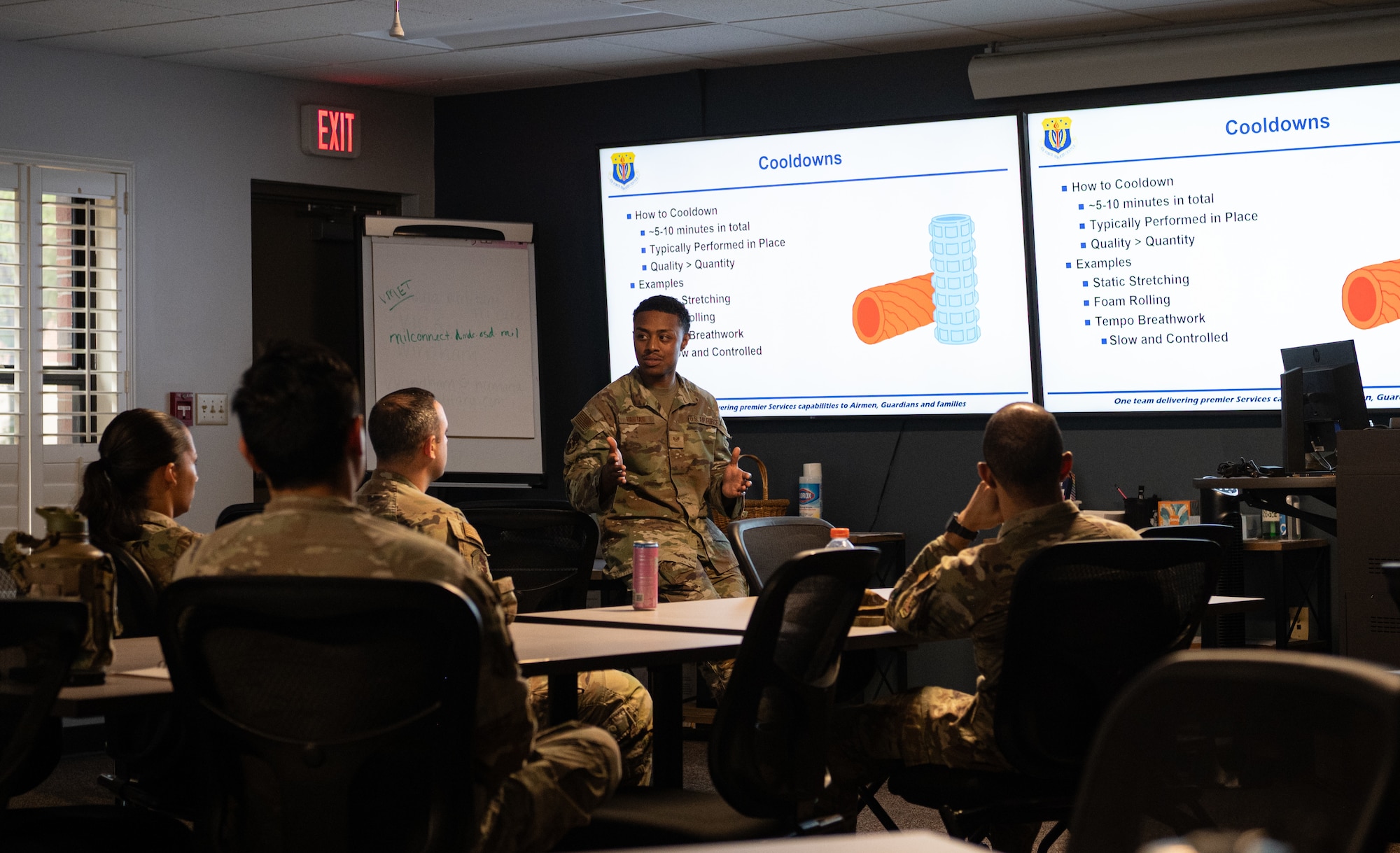 U.S. Air Force non-commissioned officers teach the Peer Fitness Leadership course material to a class of Airmen.