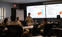 U.S. Air Force non-commissioned officers teach the Peer Fitness Leadership course material to a class of Airmen.