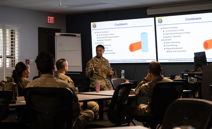 U.S. Air Force non-commissioned officers teach the Peer Fitness Leadership course material to a class of Airmen.