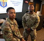 Two U.S. Airmen pose for a photo